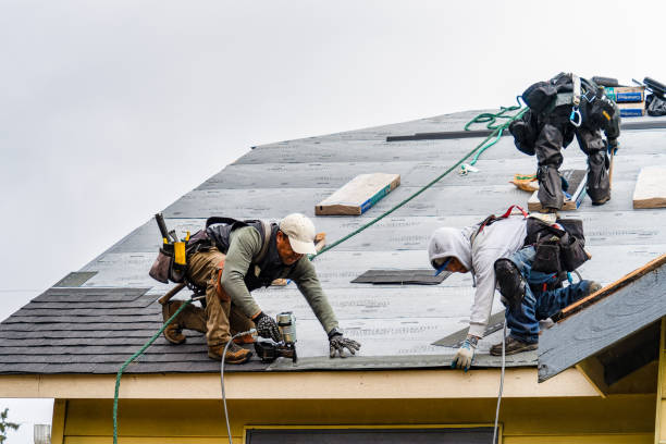 Professional Gutter Installation technician working in Readville, MA